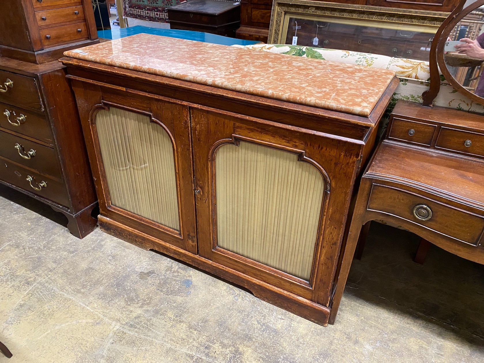 A Victorian marble top two door side cabinet, width 126cm, depth 49cm, height 93cm